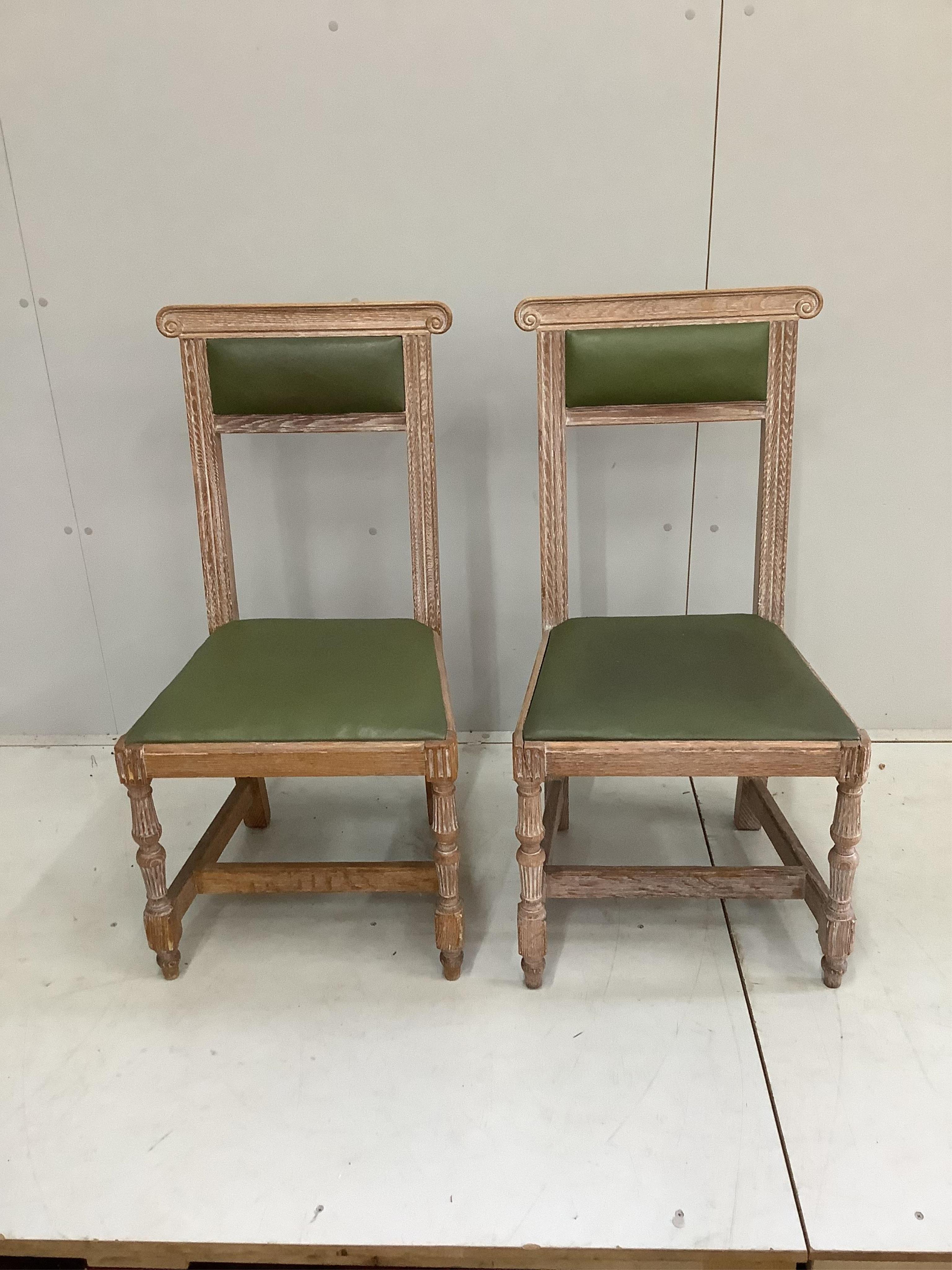 A pair of limed oak dining chairs, width 46cm, height 95cm. Condition - fair